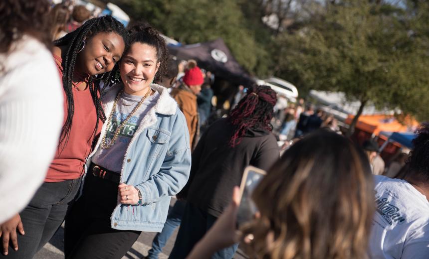 two female students pose for a photo at Homecoming 2019.