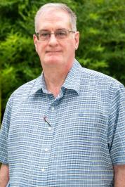 Ralph France III in a plaid dress shirt.