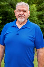 Vladislav Manoylov in a blue shirt.