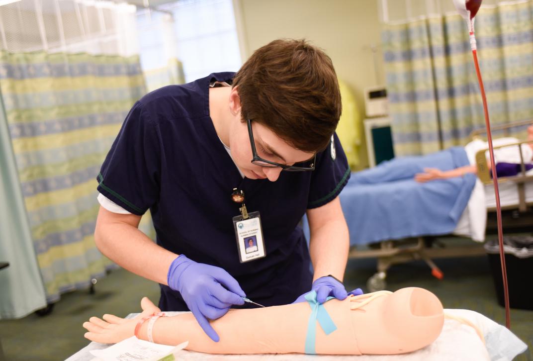 Nursing student practicing clinical skills