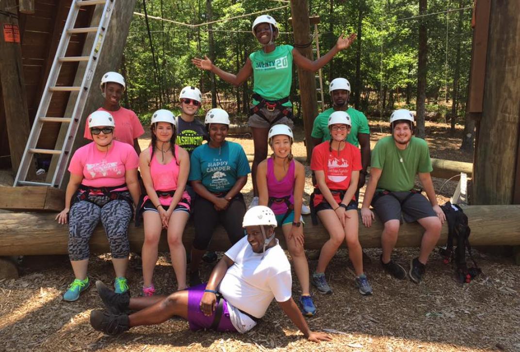 students pose at outdoor challenge course