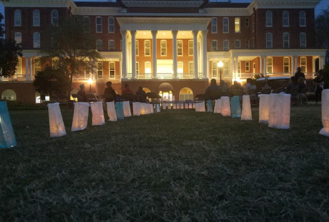 Luminaries line a walkway leading to Atkinson Hall on GC's Front Campus to honor Take Back the Night. 