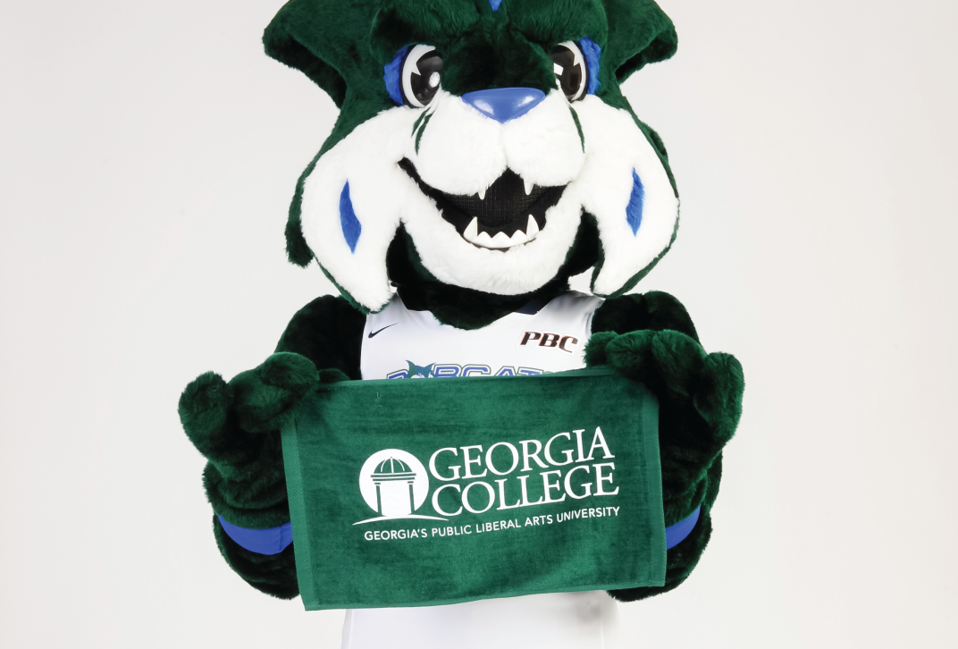 Thunder Bobcat holds a Georgia College green towel