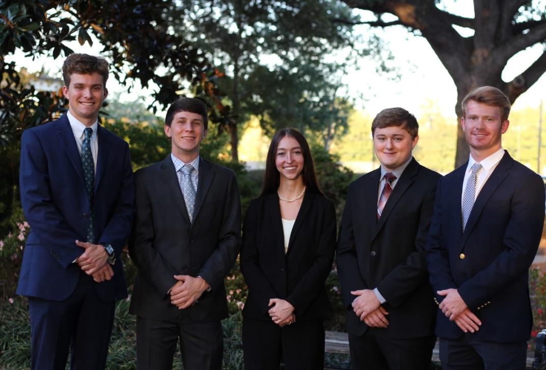 Students pose for a photo at the Chartered Financial Analyst Competition
