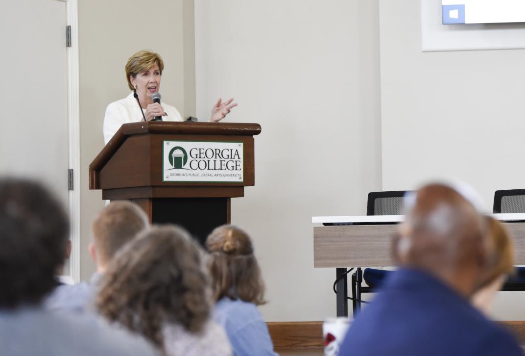 Image of GCSU President Cathy Cox speaking at New Faculty Orientation