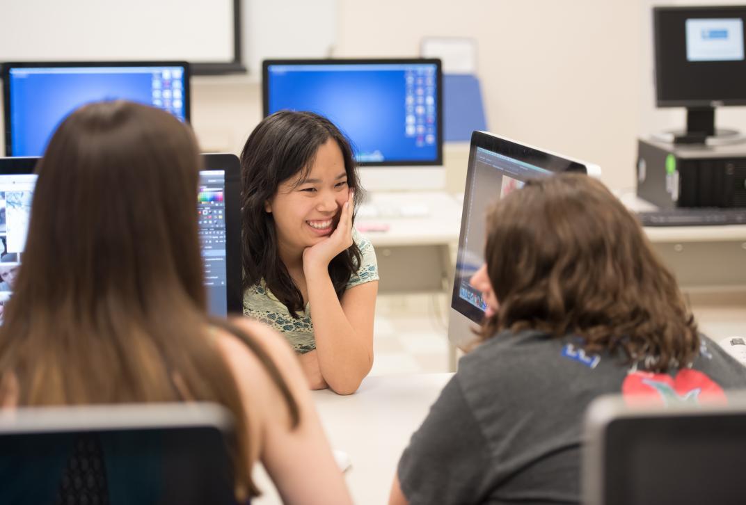 Students in a computer lab working on a project