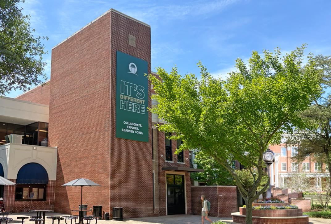 It's Different Here banner displayed on exterior MSU building at GCSU.