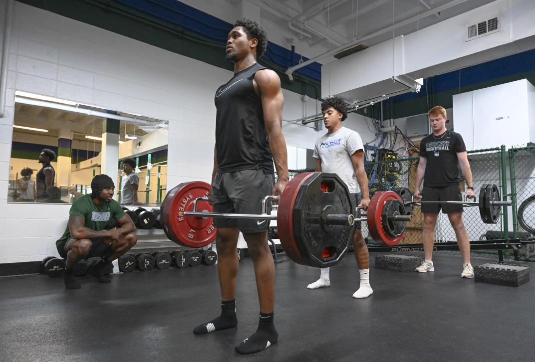 Three GCSU students lift weights