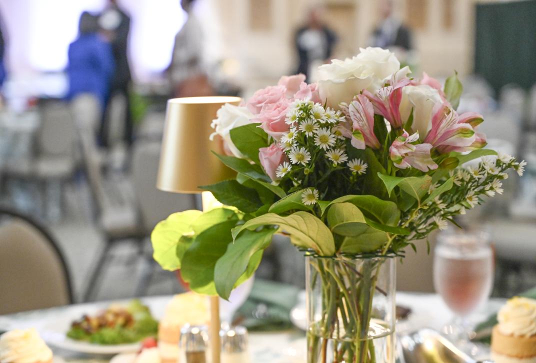 Flowers with a professional table set up at an event