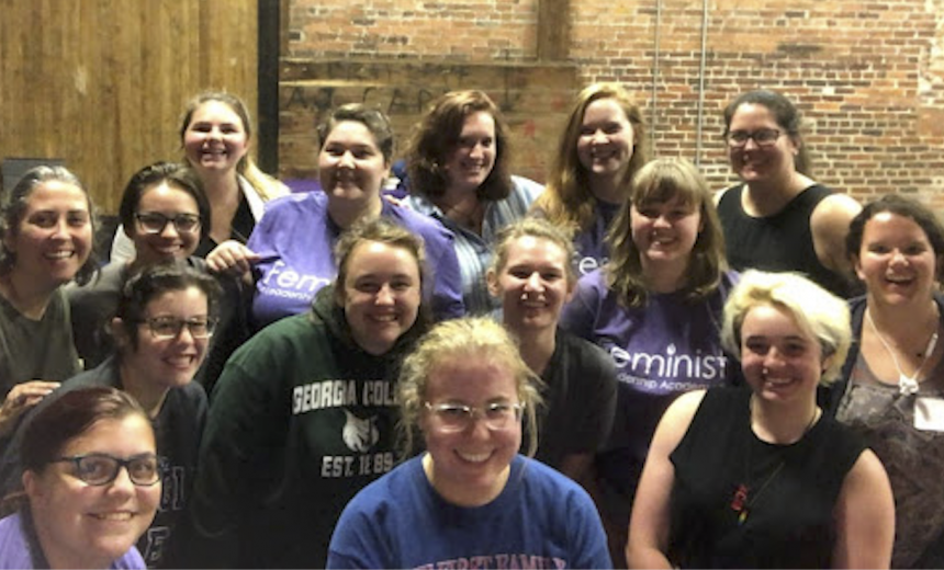Students attending the Feminist Leadership Academy gather for a picture in the Depot. 