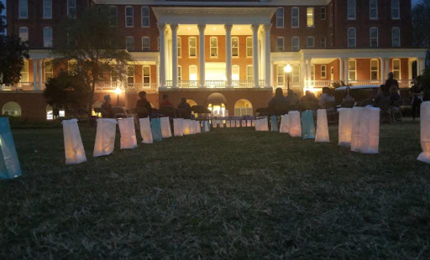 Luminaries line a walkway leading to Atkinson Hall on GC's Front Campus to honor Take Back the Night. 