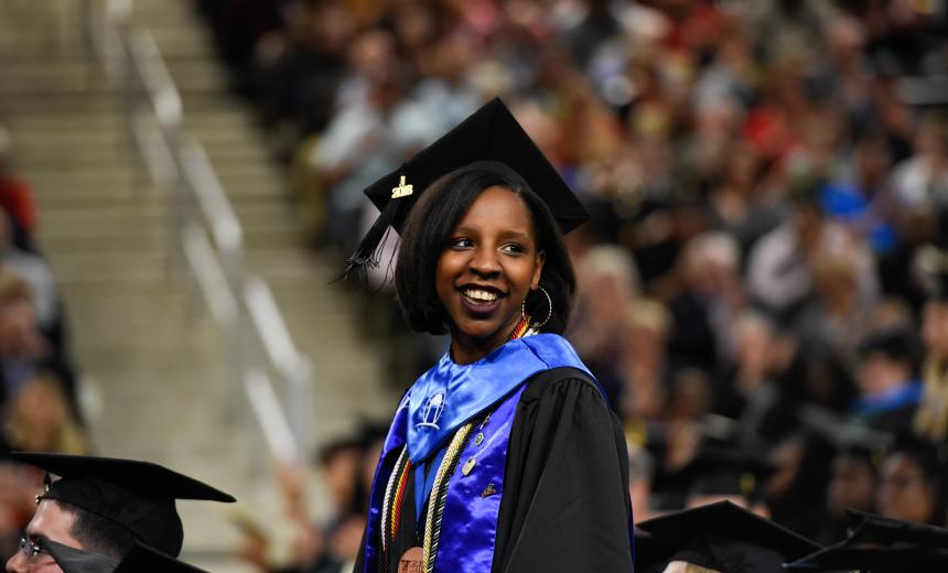 Marissa Mayfield at graduation, many honors stoles. 