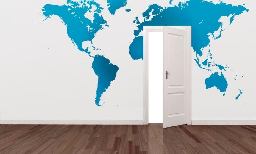 Door opening into a map of the world.