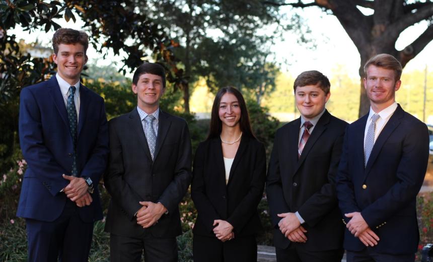 Students pose for a photo at the Chartered Financial Analyst Competition