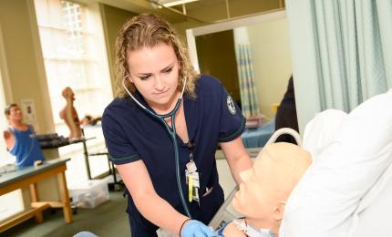 A BSN Nursing Student checks a simulated patient