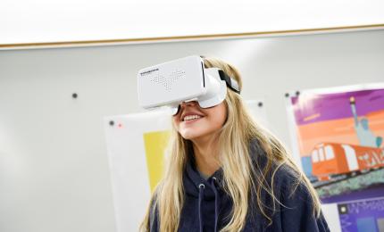 A female student has virtual reality goggles on