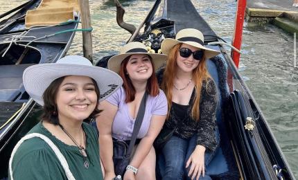 Three students in Italian canal