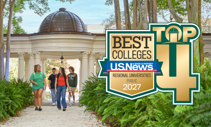 Students walking under the Pergola at Georgia College with a Top 4 US News & World Report logo