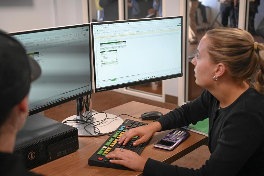 A student works on an Excel Spreadsheet on her computer