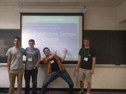 math team win in front of projector