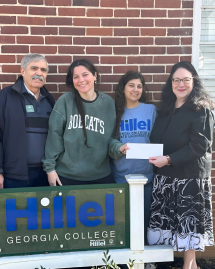 Karen Berman and Paul Jahr present award to the student organization