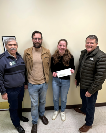 Kyle Cullars and Paul Jahr present award to student organization.