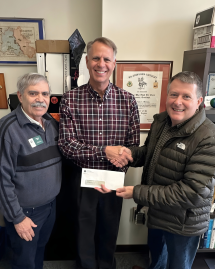 Kyle Cullars and Paul Jahr present award to student organization.